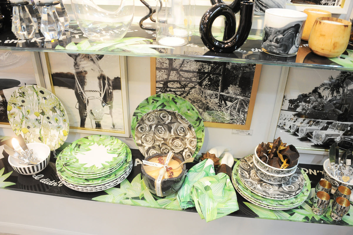 Green cabbage print plates styled on a shelf