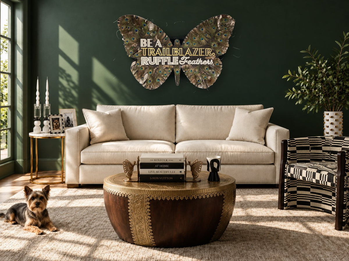 'Be A Trailblazer' butterfly artwork by Elizabeth Sutton styled in a green living room scene with ESC home decor pieces.