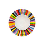 Multicolored Starburst 12 piece starter set of melamine dinnerware, overhead view