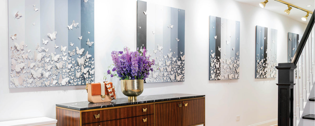 Entryway with a console table and mirrored wall art