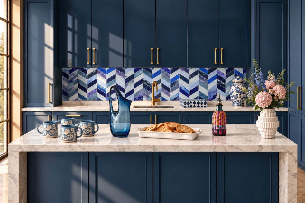 Navy blue kitchen island styled scene with blue glass pitcher, mugs and vases