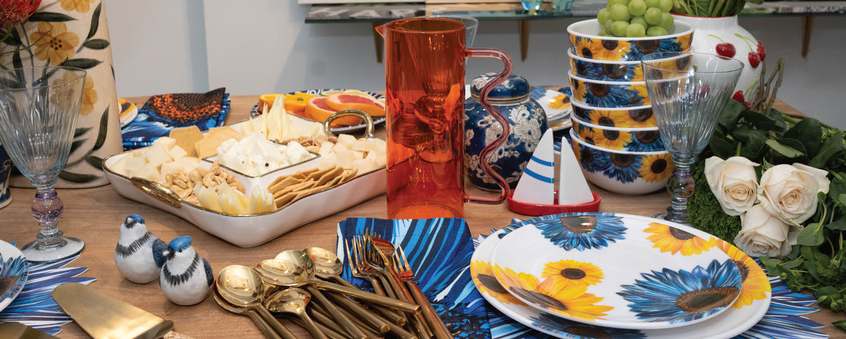 Long table styled with sunflower print dinnerware