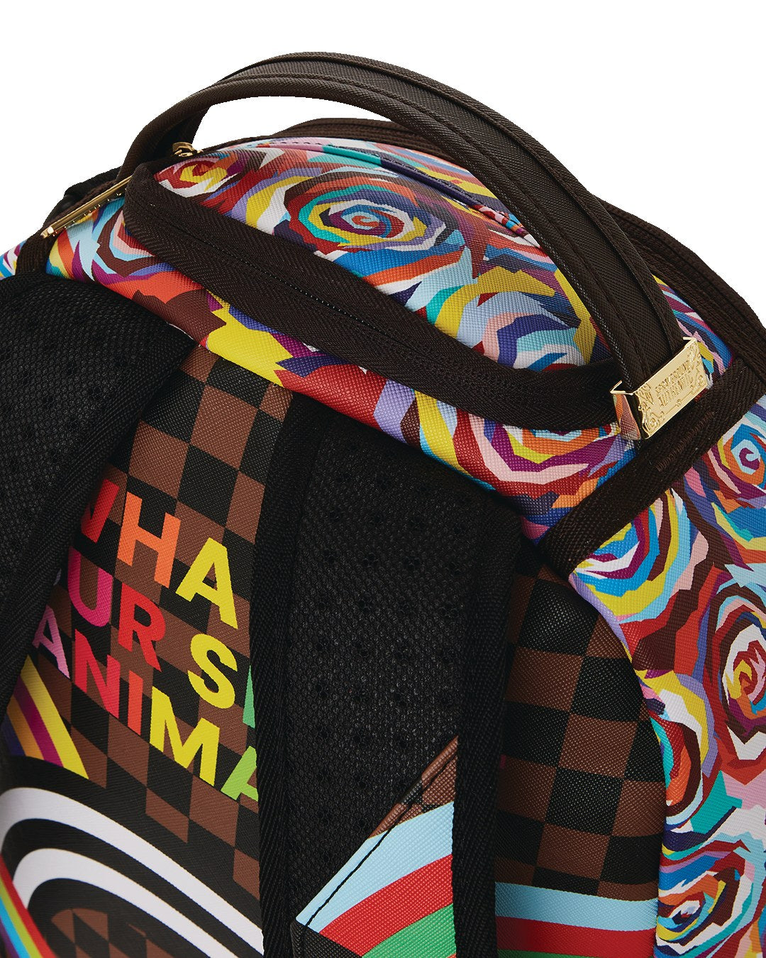 Sprayground backpack detail with checkered and floral panels