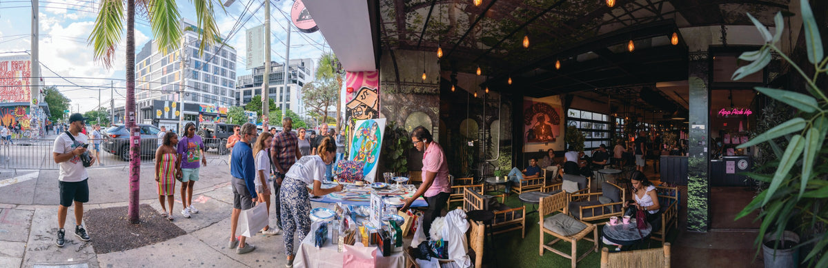 Elizabeth Sutton hosting a live painting event in Miami, FL during Art Basel 2021