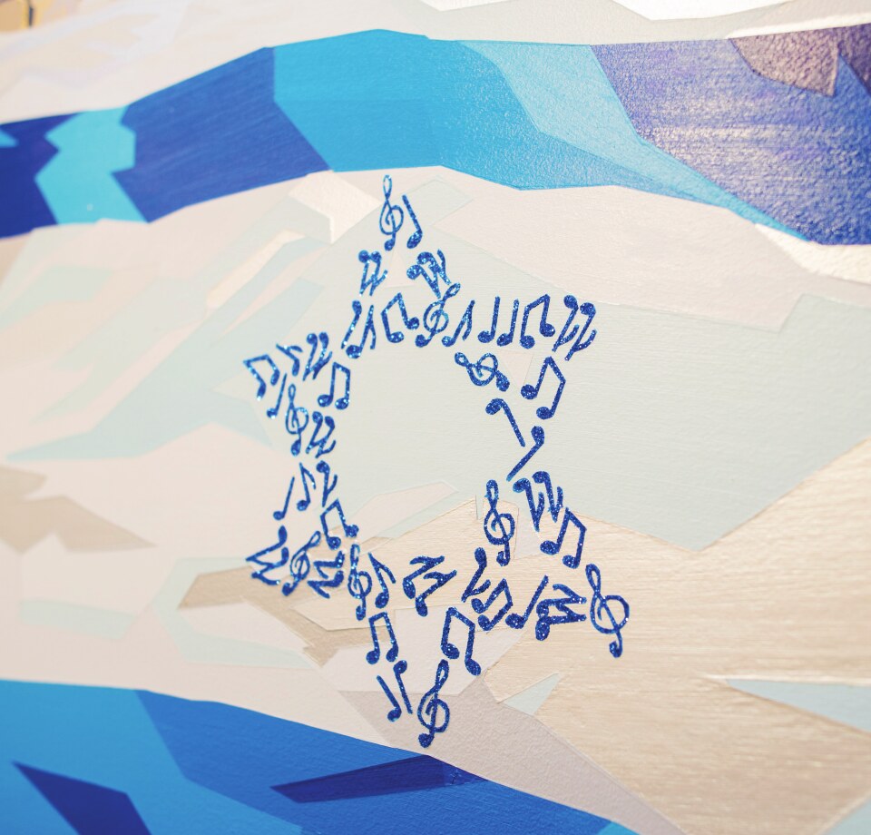 Star of David painted in musical notes over a blue landscape
