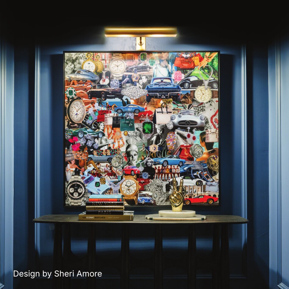 Framed collage artwork in a dark interior