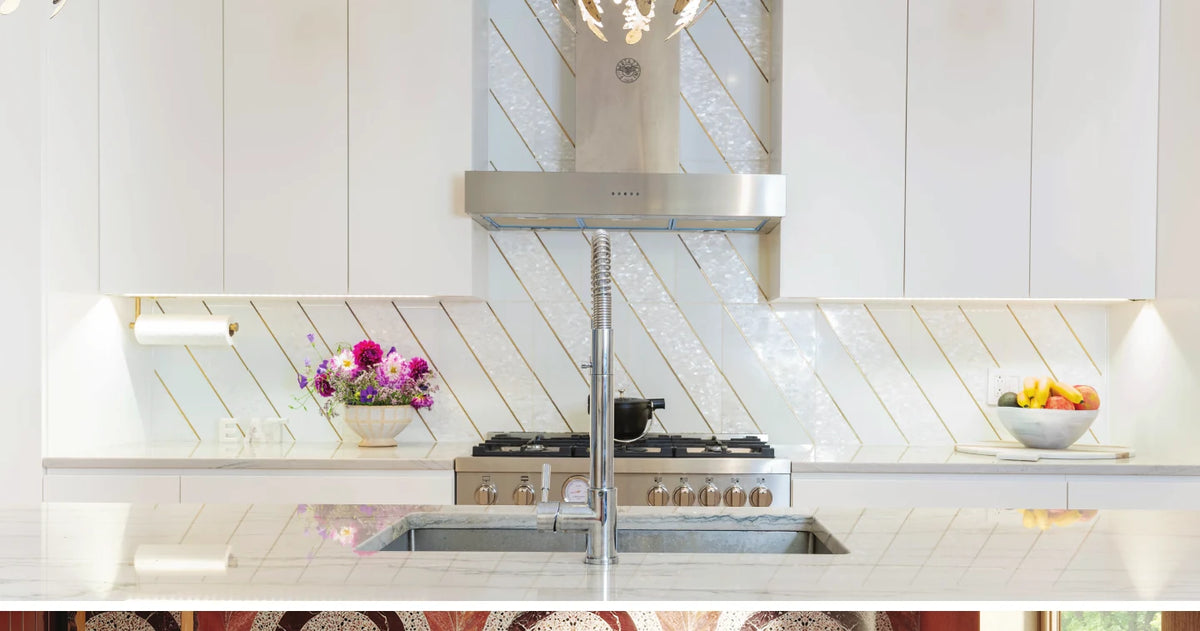 White kitchen with gold inlay tile backsplash