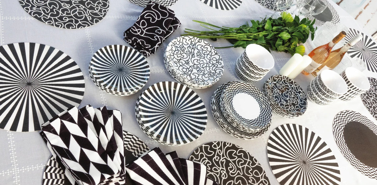 Table set with black and white starburst melamine dinnerware