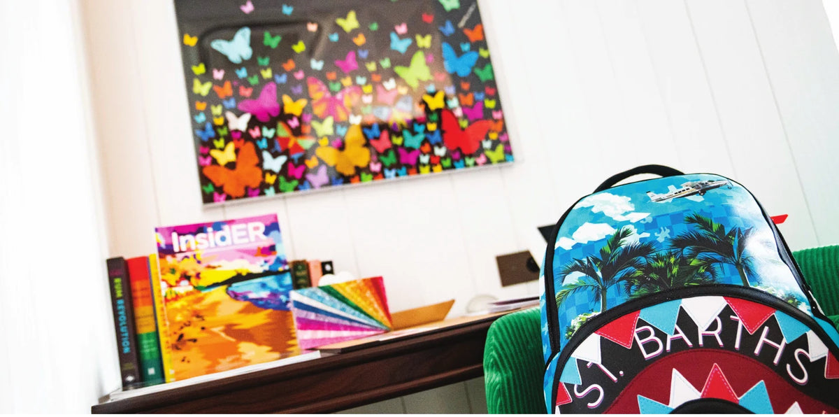Butterfly artwork with books and a custom backpack