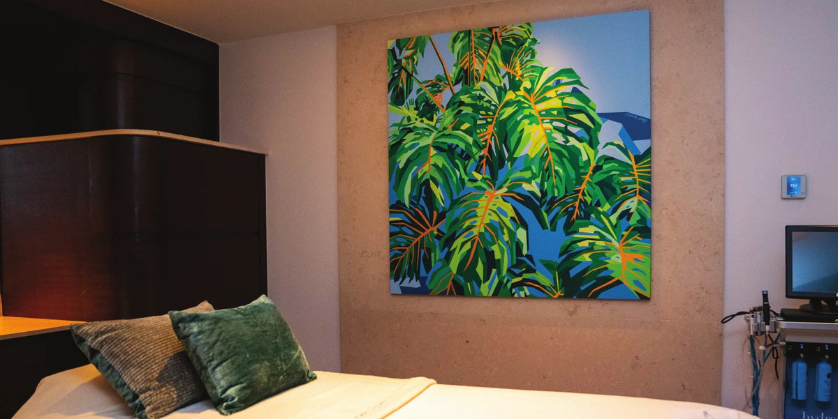 Guest room with a large palm painting