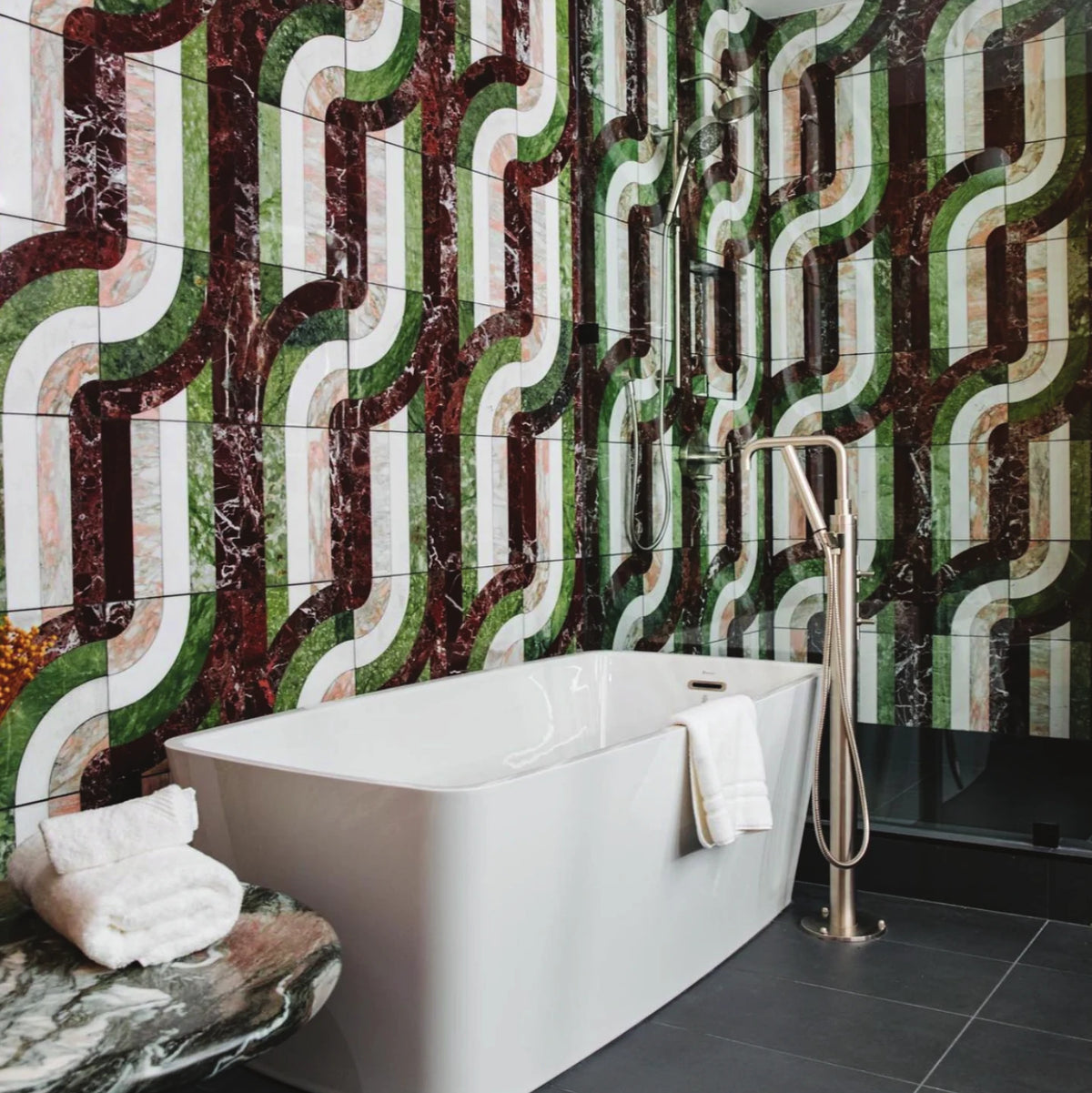 The Drake Hotel bathroom with green and burgundy arc tile