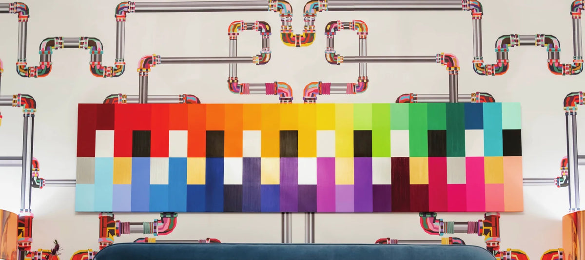 Interior with industrial pipe wallpaper and a color grid panel