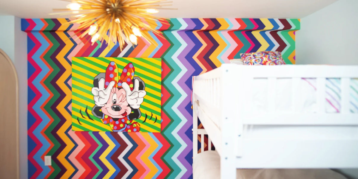 Children's room with rainbow chevron wallpaper