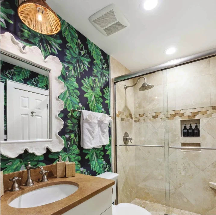Bathroom with green palm print wallpaper