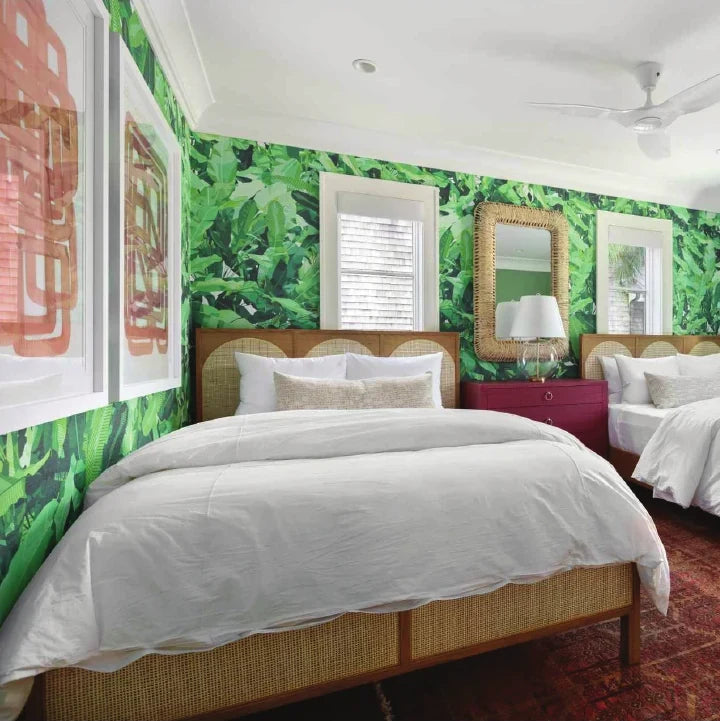 Bedroom with green palm print wallpaper